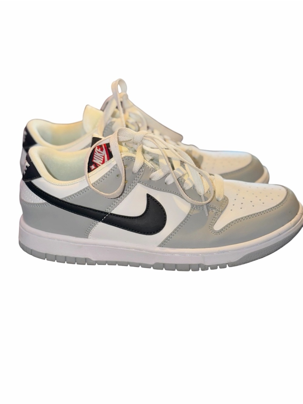 Nike woman’s Low-Top Sneakers in White, Gray & Black